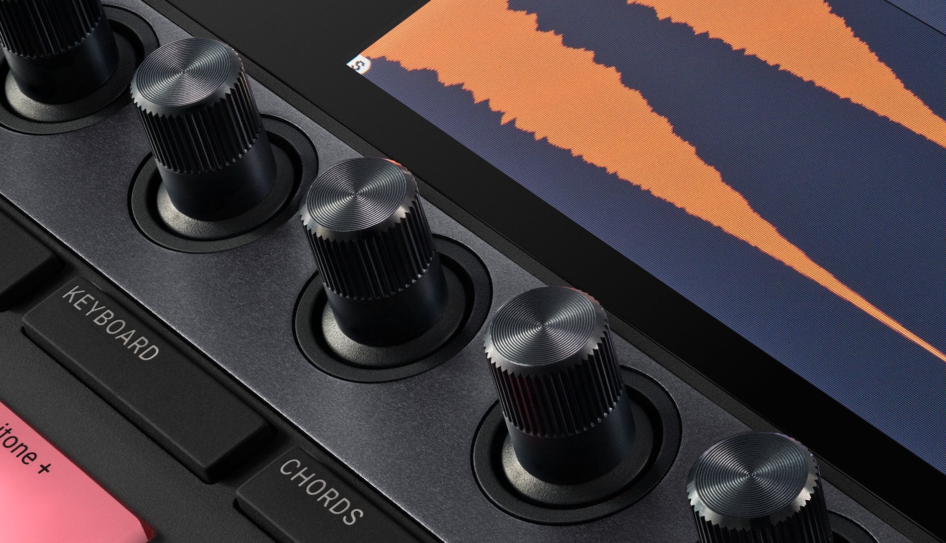 Native Instruments Maschine+ drum machine and sampler with colorful pads and interface, ready for music production.