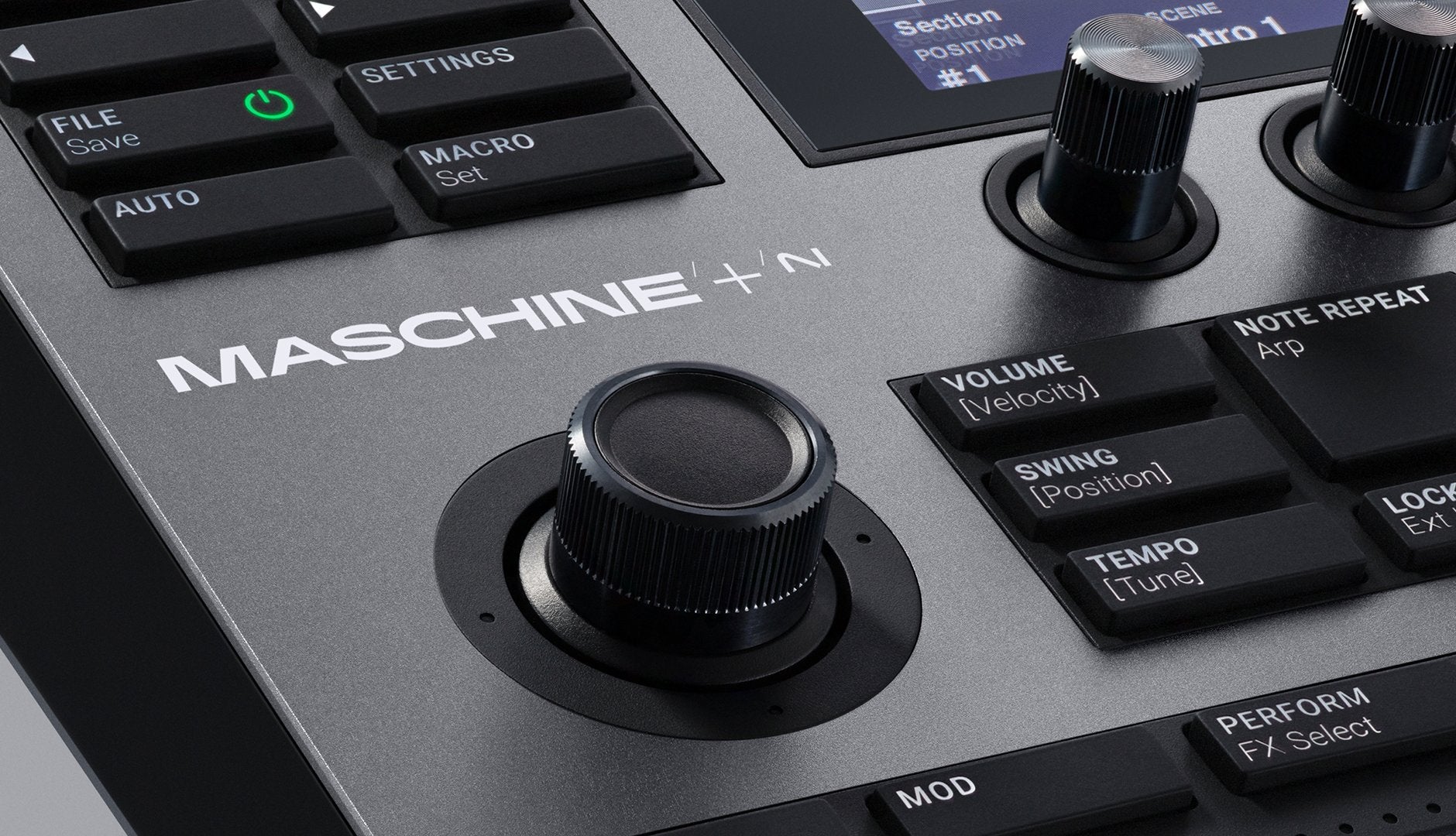 Native Instruments Maschine+ drum machine and sampler with grid controller, buttons, and touchscreen display.