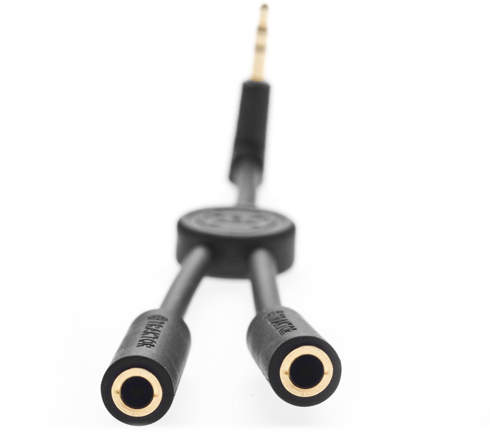 Native Instruments Traktor DJ Cable adapter, a splitter for DJ equipment with multiple connection ports.