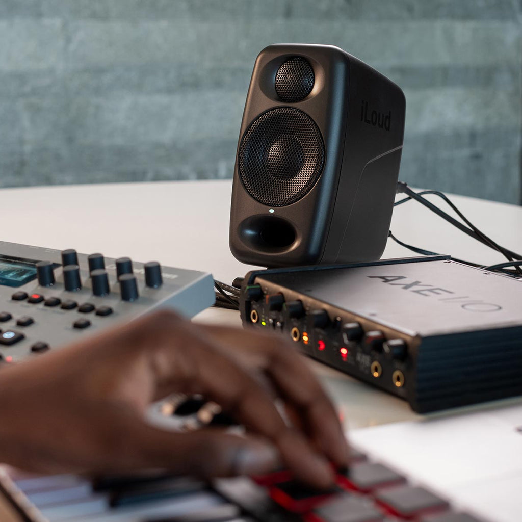 IK Multimedia iLoud Micro Monitor Pro active nearfield monitor speakers with sleek black design and controls visible.