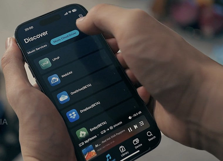 Eversolo Play music streamer displaying a sleek black device with digital display and control buttons.