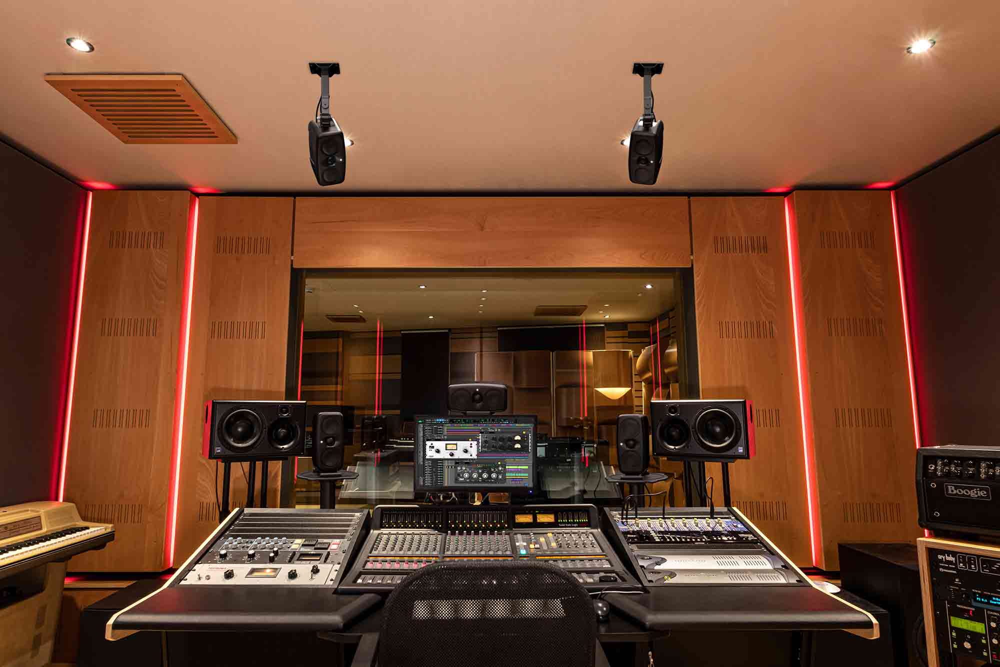 IK Multimedia iLoud MTM MK2 active nearfield monitors shown with sleek black finish and front controls for professional audio monitoring.