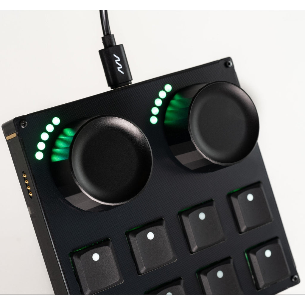 Intech Studio TEK2 Mechanical Series 3 MIDI controller with multiple black keys and control knobs on a sleek surface.