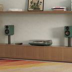 Kanto Audio OBI3 Gen 2 turntable, Green, in a living-room media console setup