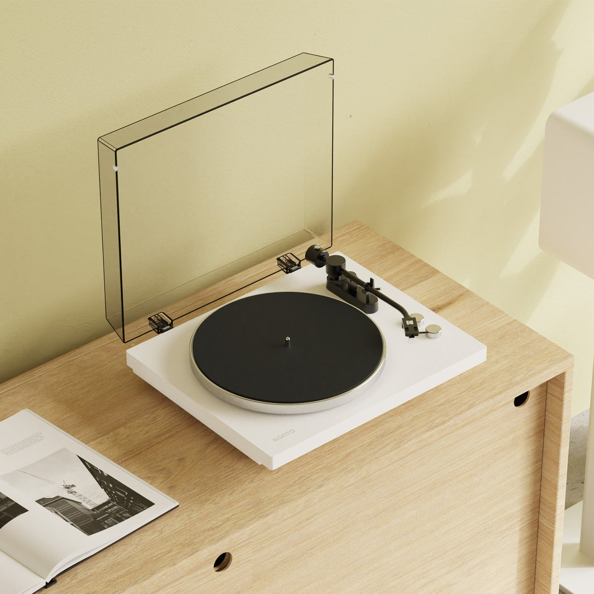 Kanto Audio OBI3 Gen 2 turntable, White, on a wooden console