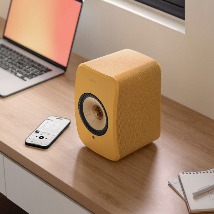KEF LSX II wireless bookshelf speakers, in amber haze and cotton white