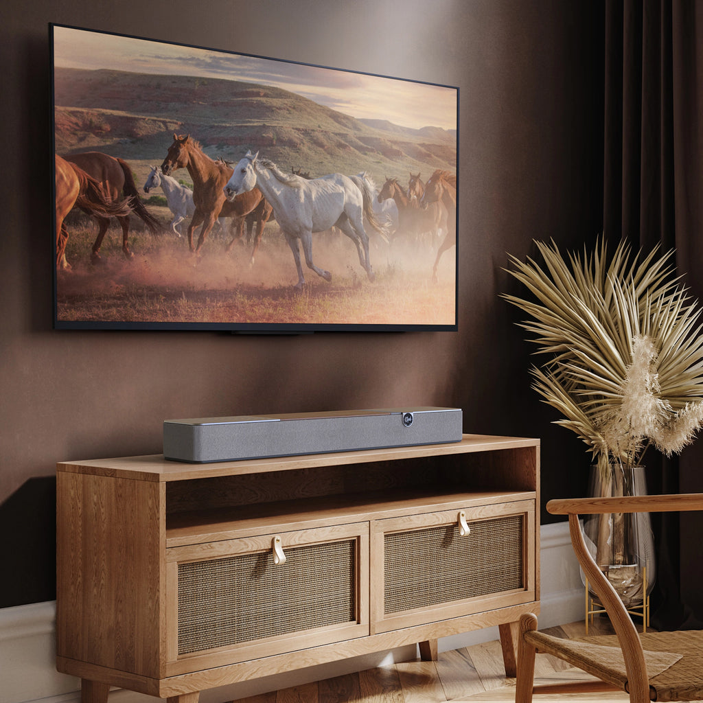 Klipsch Flexus Core 100 soundbar, under wall TV in living room.