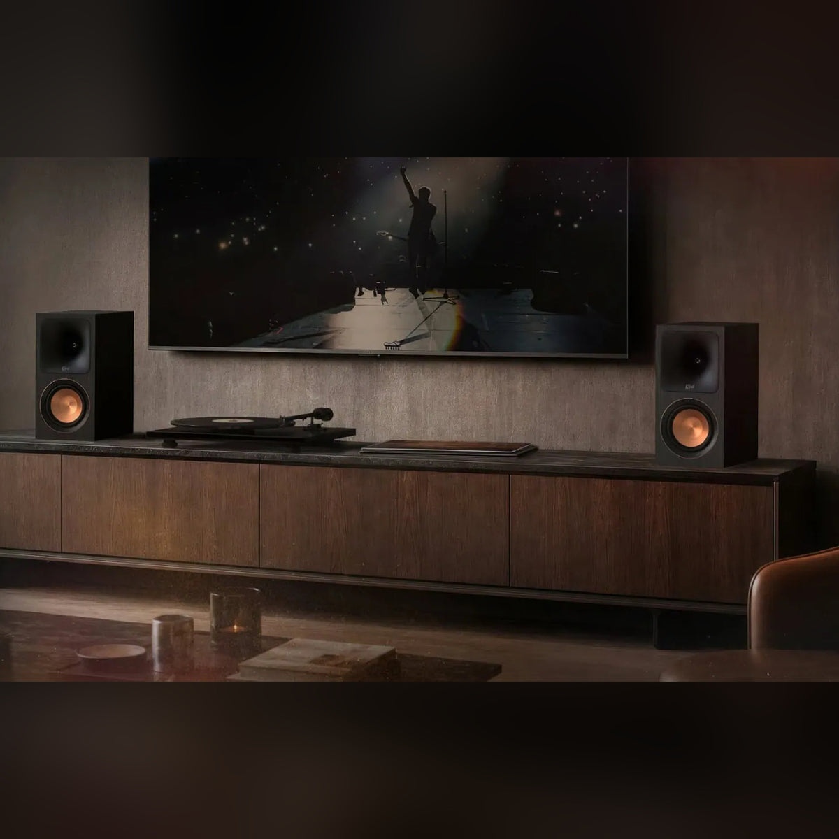Klipsch RP-500PM powered speakers in a living room with a TV and turntable