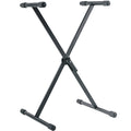 K&M 18933 keyboard stand supporting electronic keyboard with adjustable height and sturdy metal construction.