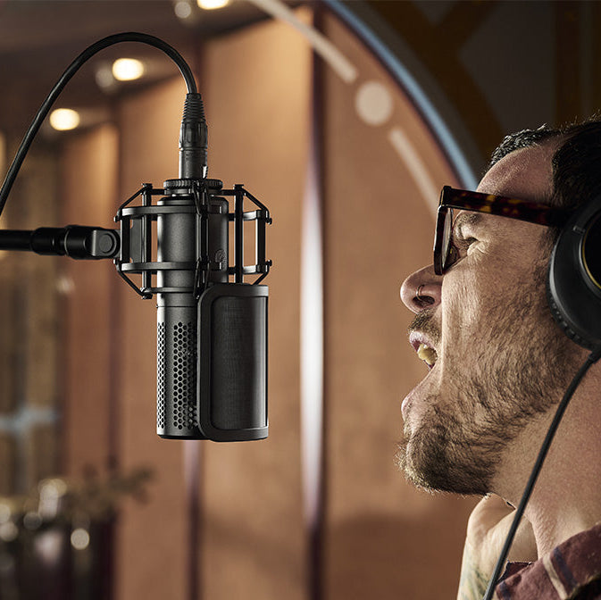 Shure KSM44MP condenser microphone with multiple pickup patterns and professional studio design.