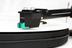 Sumiko Olympia MM phono cartridge installed on a turntable, showcasing its sleek design and high-quality build for vinyl playback.