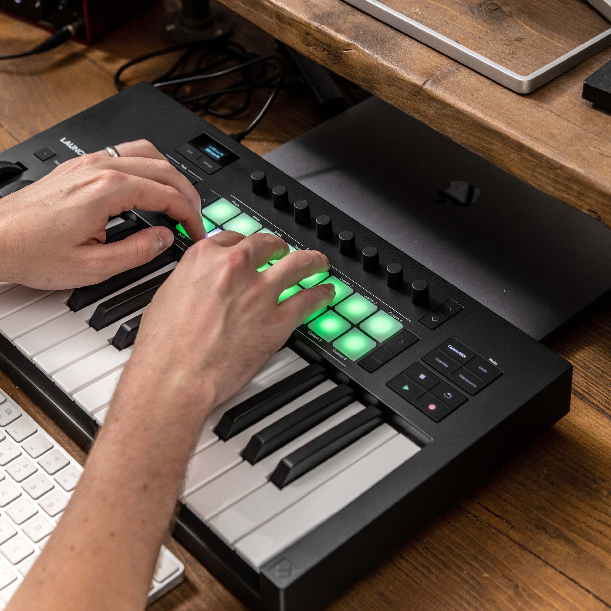 Novation Launchkey 25 MK4 MIDI keyboard with 25 keys, control knobs, and pads for music production and performance.