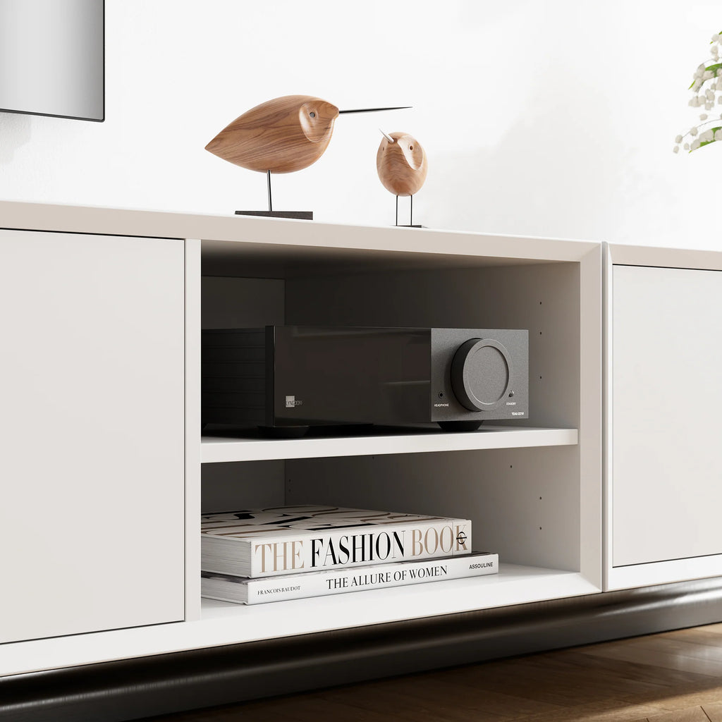 Lyngdorf TDAI-2210 stereo amplifier with sleek black design and control knobs, showcasing its integrated audio system features.