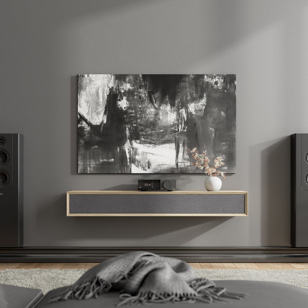 Lyngdorf TDAI-2210 stereo amplifier with RoomPerfect technology, sleek black design, and digital control buttons.