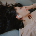 Woman wearing the Meze Audio Alba S in-ear monitors
