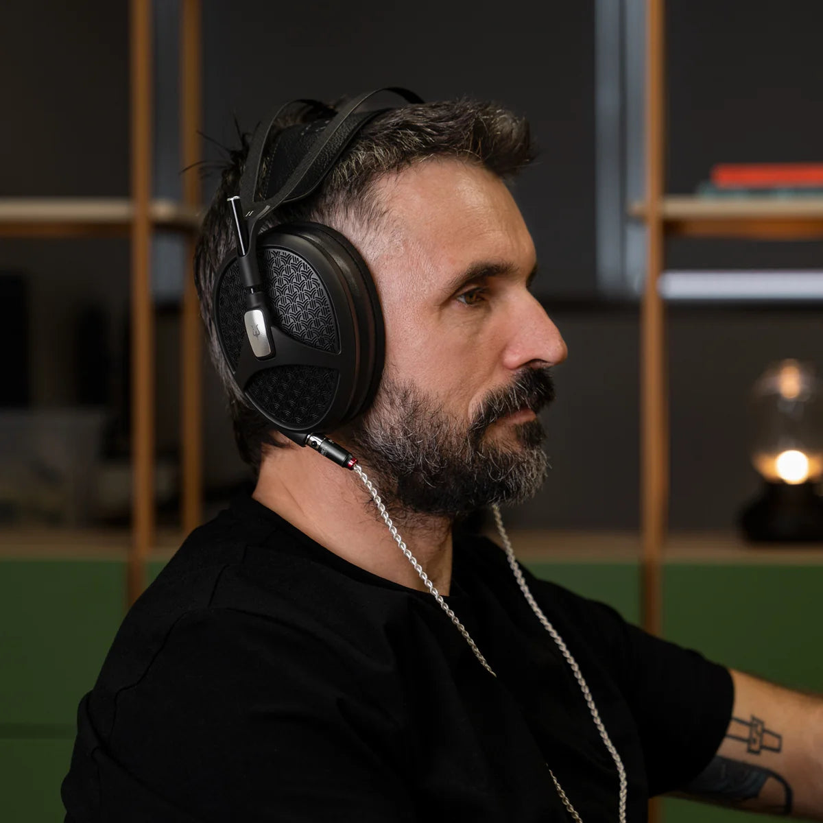 Meze Audio Empyrean II wired headphones with open-back design and plush ear cups, showcasing premium build and detailed craftsmanship.