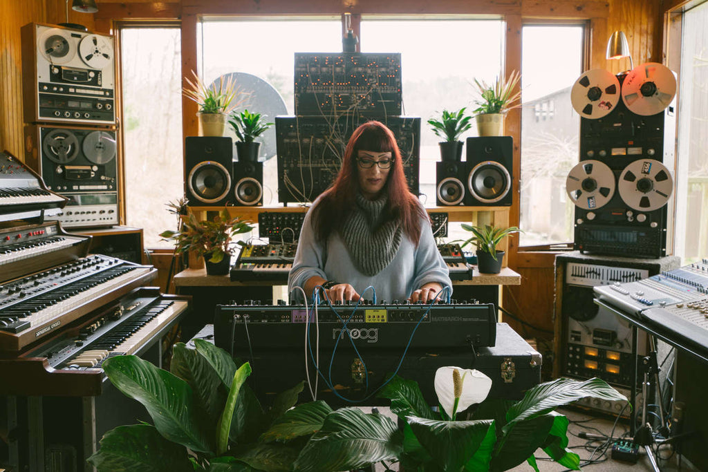 Moog Matriarch synthesizer with patch cables and control knobs, showing its vintage-inspired design and multiple audio and modulation inputs.