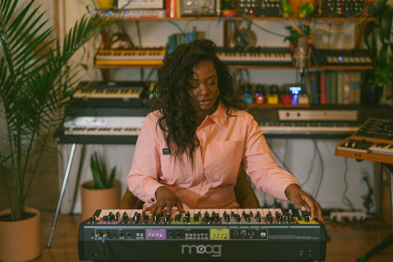 Moog Matriarch synthesizer with multiple knobs, patch points, and keyboard, showcasing its analog electronic music interface.