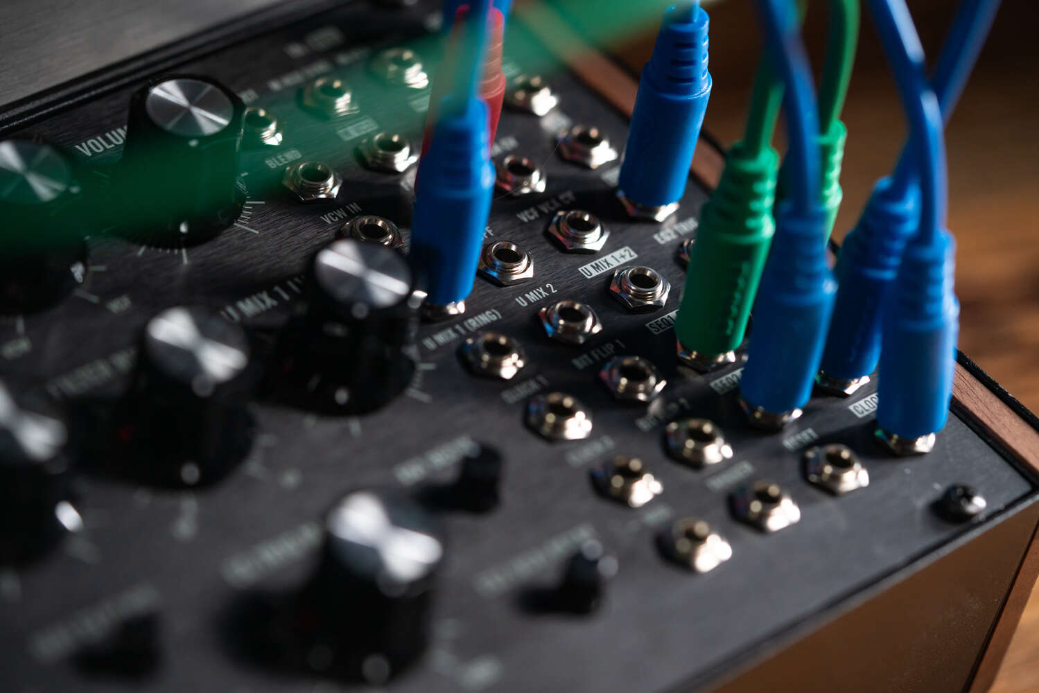 Close-up of Moog Labyrinth synthesizer showing detailed control knobs and vintage-inspired design elements.