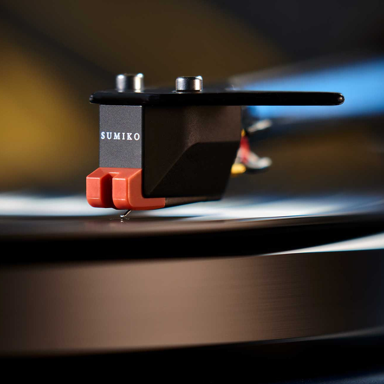 Sumiko Moonstone MM phono cartridge mounted on a turntable cartridge, featuring a sleek design for vinyl record playback.