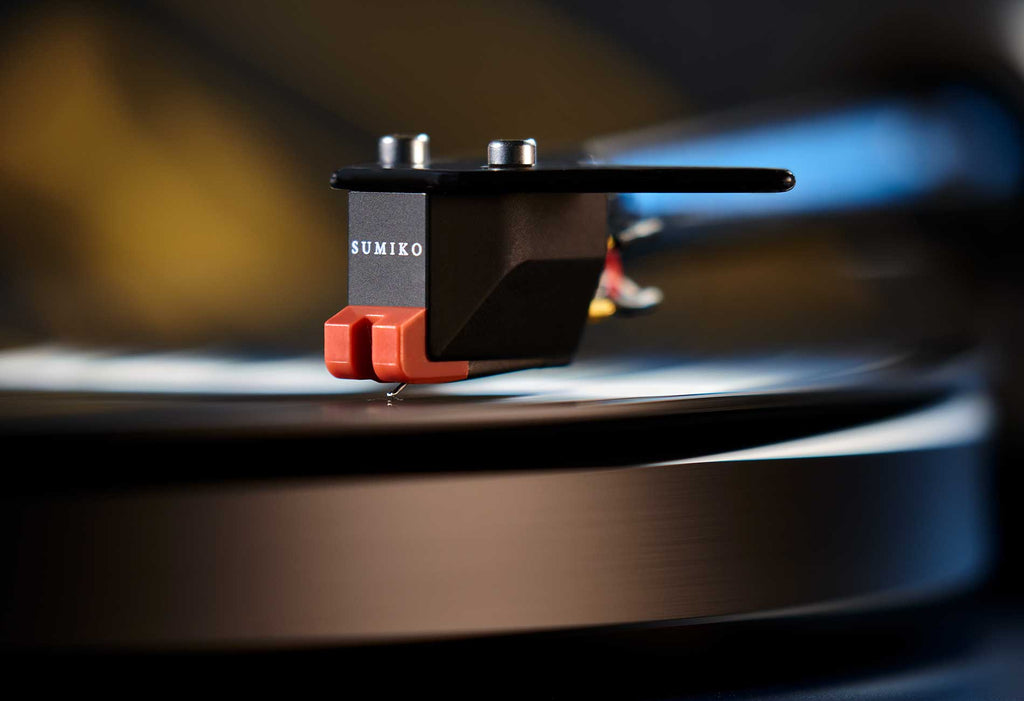 Sumiko Moonstone MM phono stylus resting on a turntable cartridge, designed for high-quality vinyl playback.