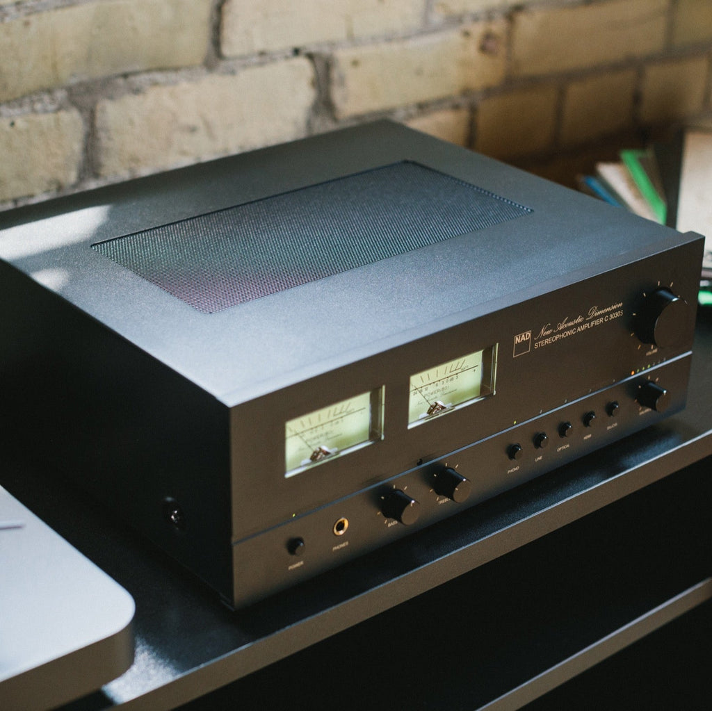 NAD C 3030S stereo amplifier with sleek black front panel and control knobs, designed for high-quality audio performance.