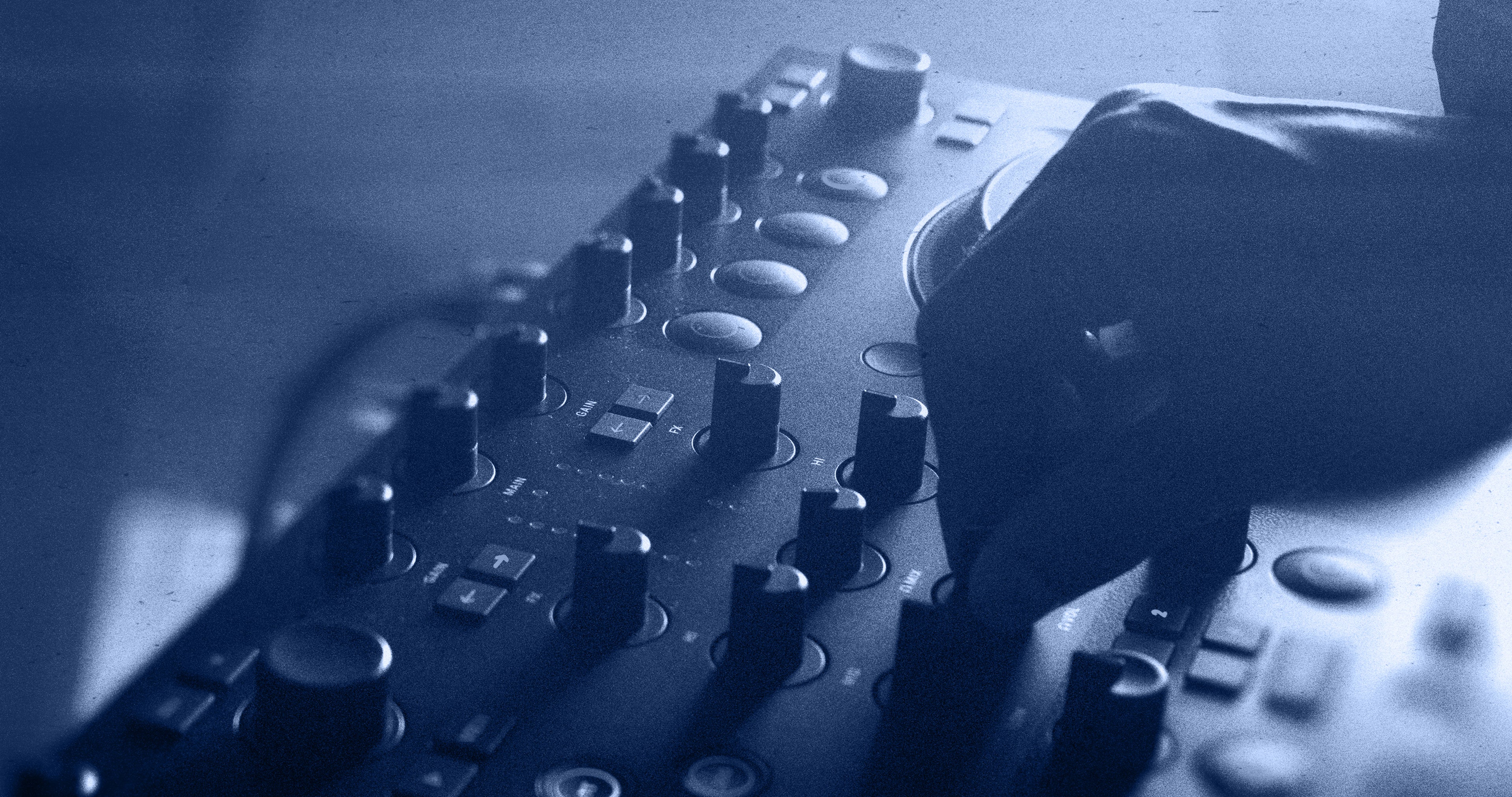 Native Instruments Traktor MX2 DJ controller with dual jog wheels, mixer knobs, and performance pads for professional DJ mixing.