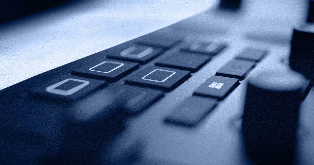 Native Instruments Traktor MX2 DJ controller with dual jog wheels, buttons, and knobs for professional DJ mixing and control.