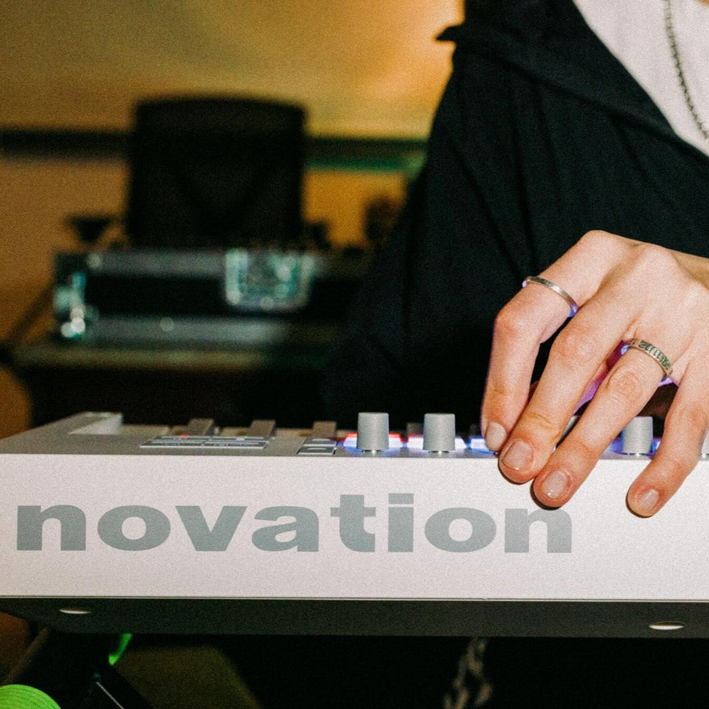 Novation Launchkey 49 MK4 MIDI keyboard, in white, lifestyle setting