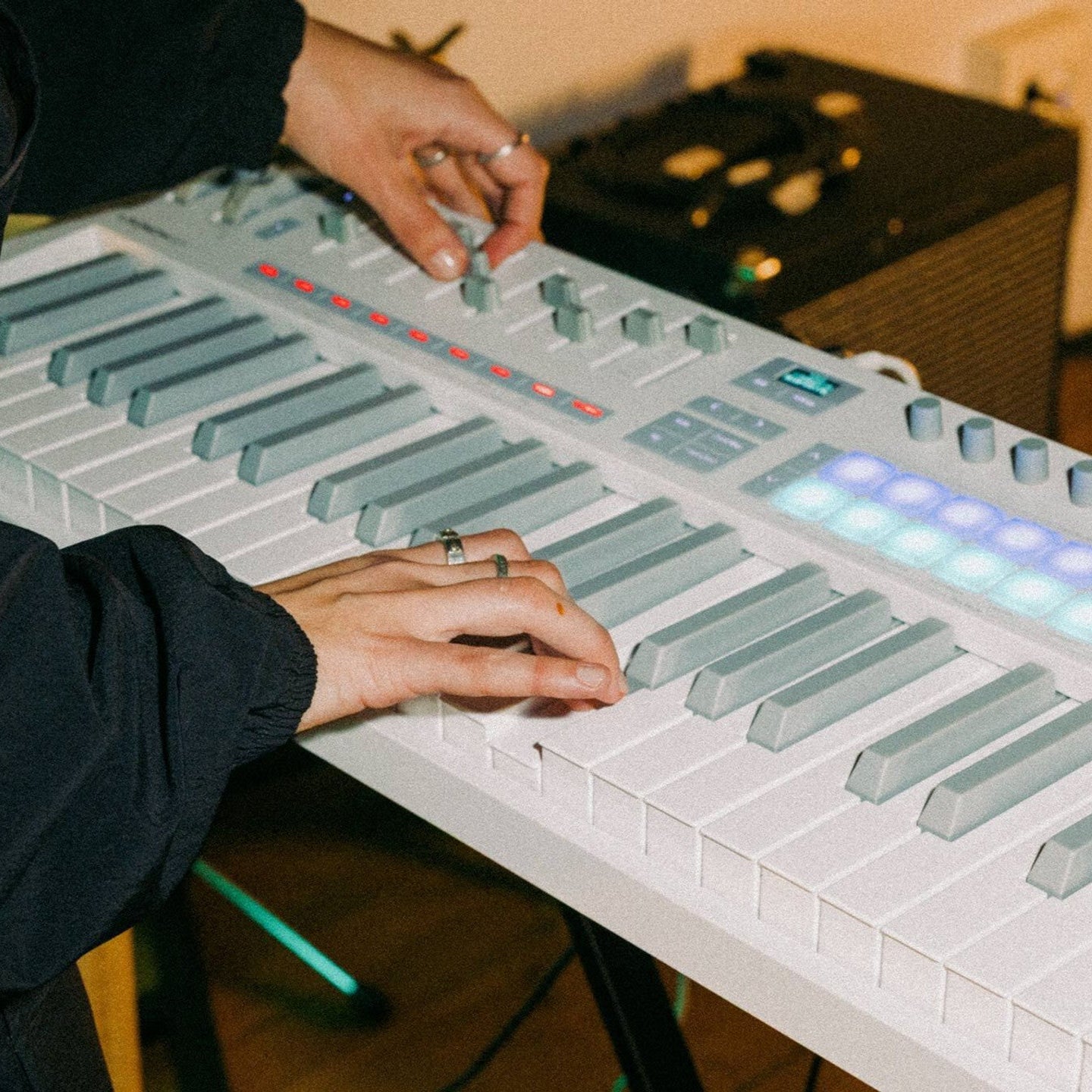 Novation Launchkey 49 MK4 MIDI keyboard, in white, lifestyle setting