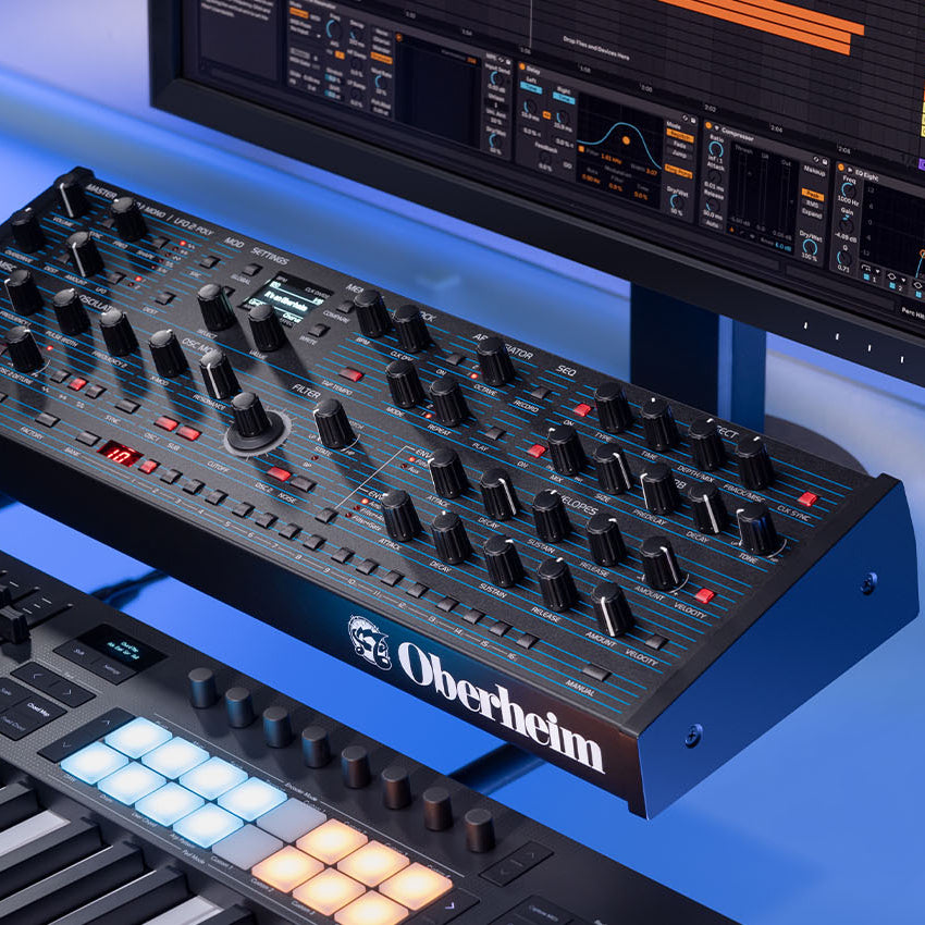 Oberheim TEO-5 desktop synthesizer with control knobs and interface, designed for electronic music production and sound design.