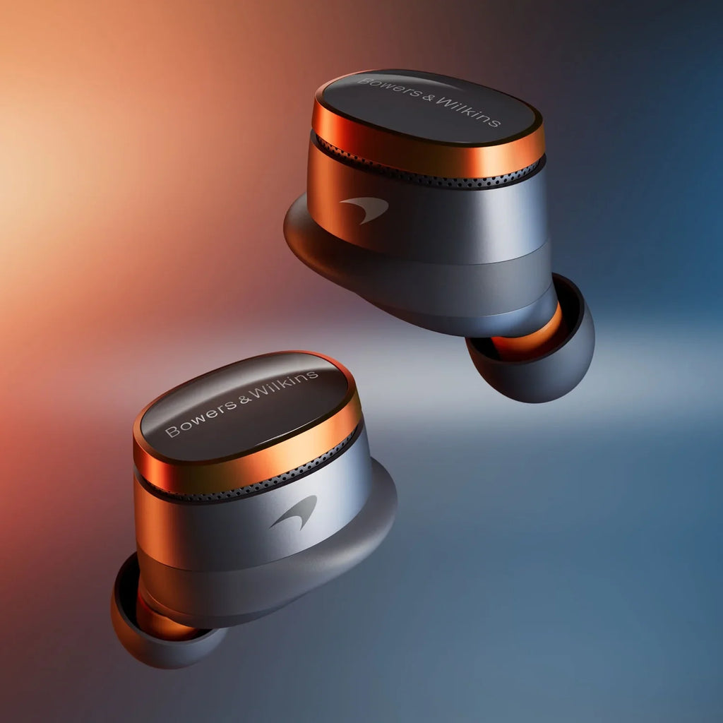 Bowers & Wilkins Pi8 wireless in-ear headphones with sleek design and textured ear tips, featuring McLaren branding details.