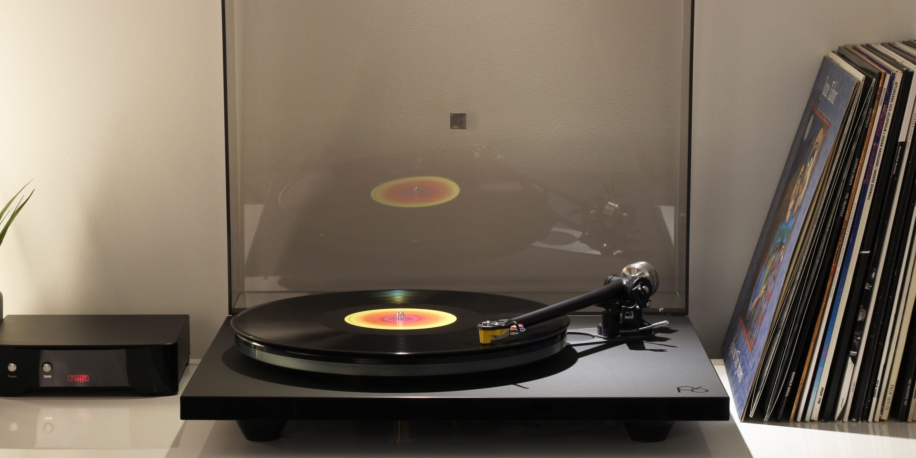 Rega Planar 6 turntable in Polaris Grey with Nd5 cartridge, showcasing the sleek design and tonearm details.