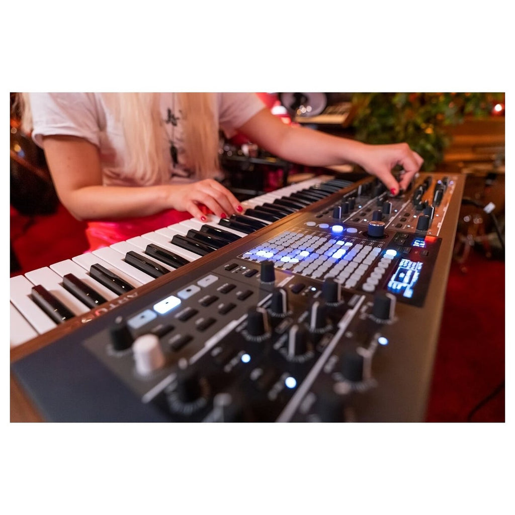 Arturia PolyBrute synthesizer with a sleek control panel and colorful LED display, showcasing its professional music production features.