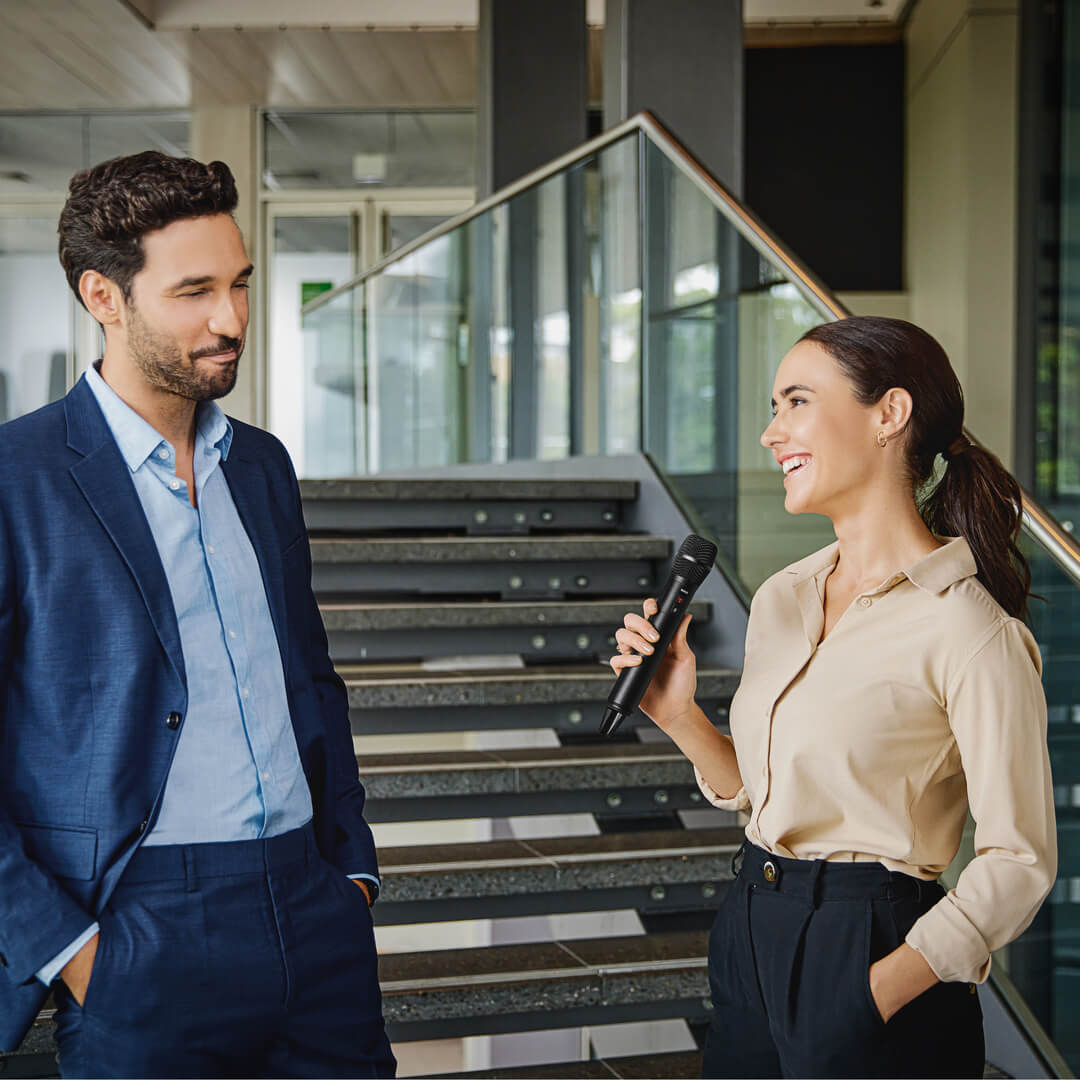 Rode Interview Pro wireless microphone accessory used in a couple's in-situ interview on a staircase.