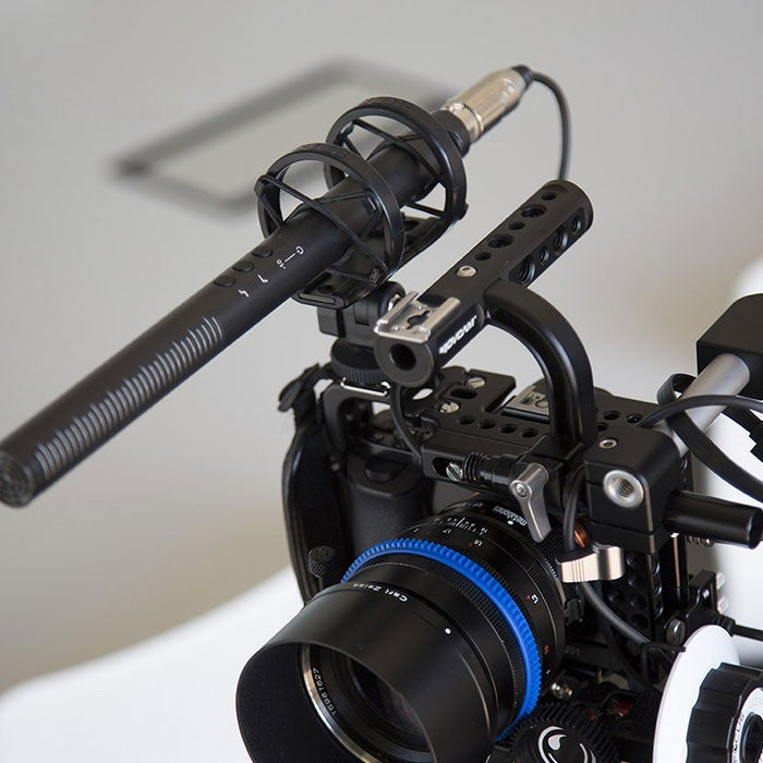 Rode NTG4+ shotgun microphone with black windscreen and mounting clip, designed for professional audio recording.