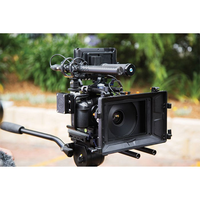 Rode NTG4+ shotgun microphone mounted on a boom pole, professional audio recording equipment for film and video production.