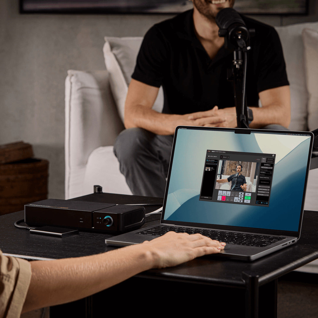 Rode RodeCaster Video Core switcher and controller for video editing, featuring multiple buttons and RGB lighting on a sleek black panel.