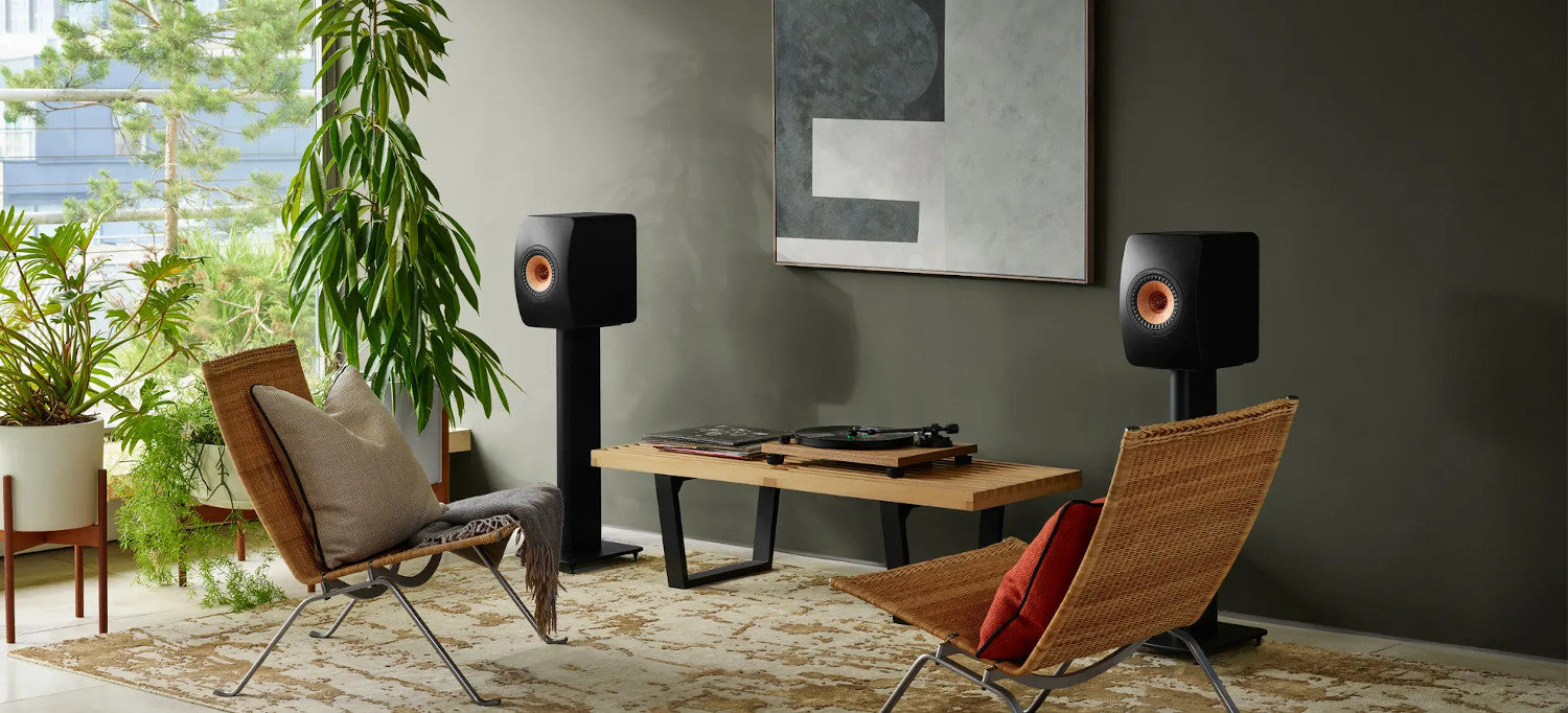 KEF S2 speaker stands for KEF LS50 speakers, featuring a sleek black design and sturdy construction for optimal sound support.