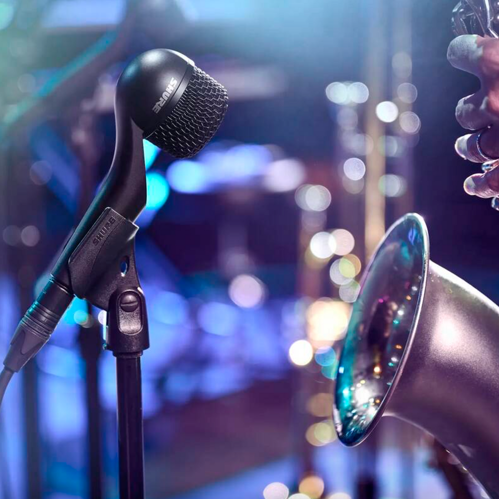 Shure Nexadyne 5 dynamic microphone with a sleek black body and metal grille for professional audio recording and live sound.