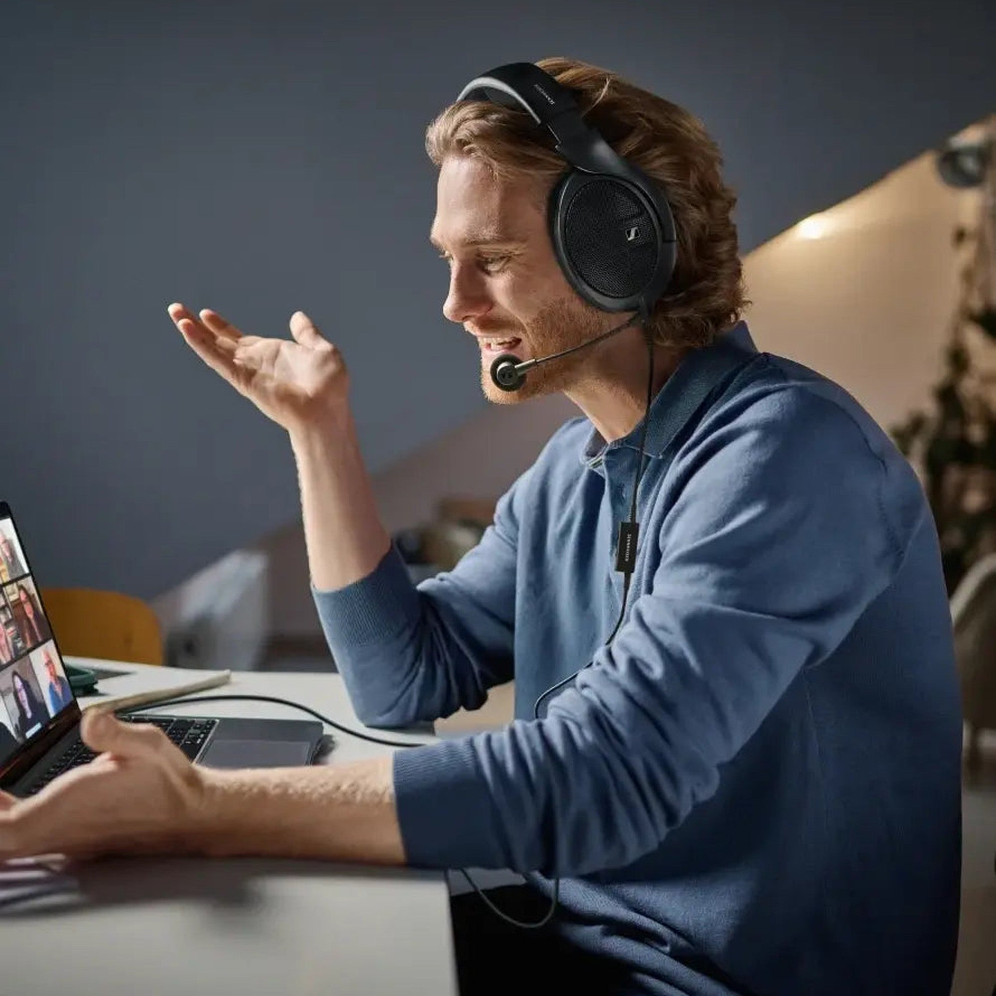 Man on a call wearing Sennheiser headphones with the HD 500 BAM boom mic