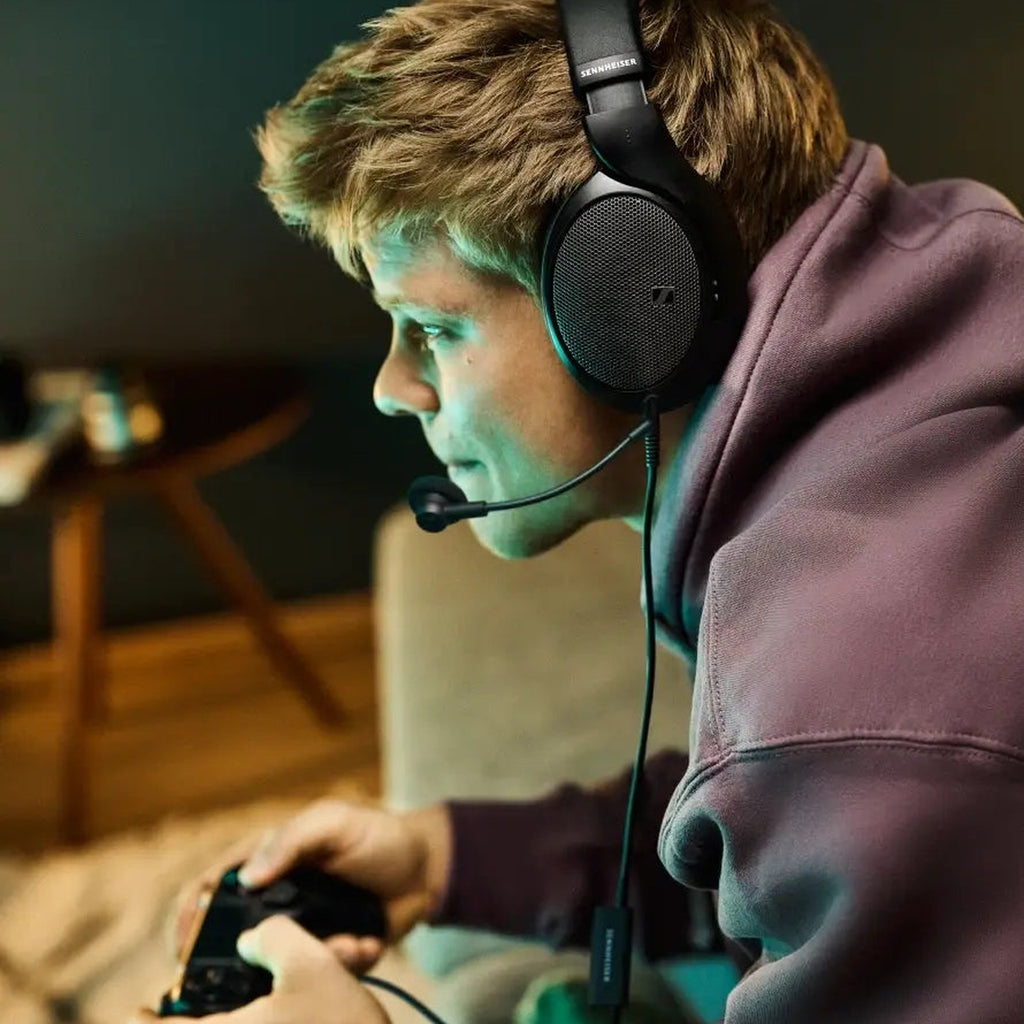 Gamer wearing Sennheiser headphones with the HD 500 BAM boom microphone