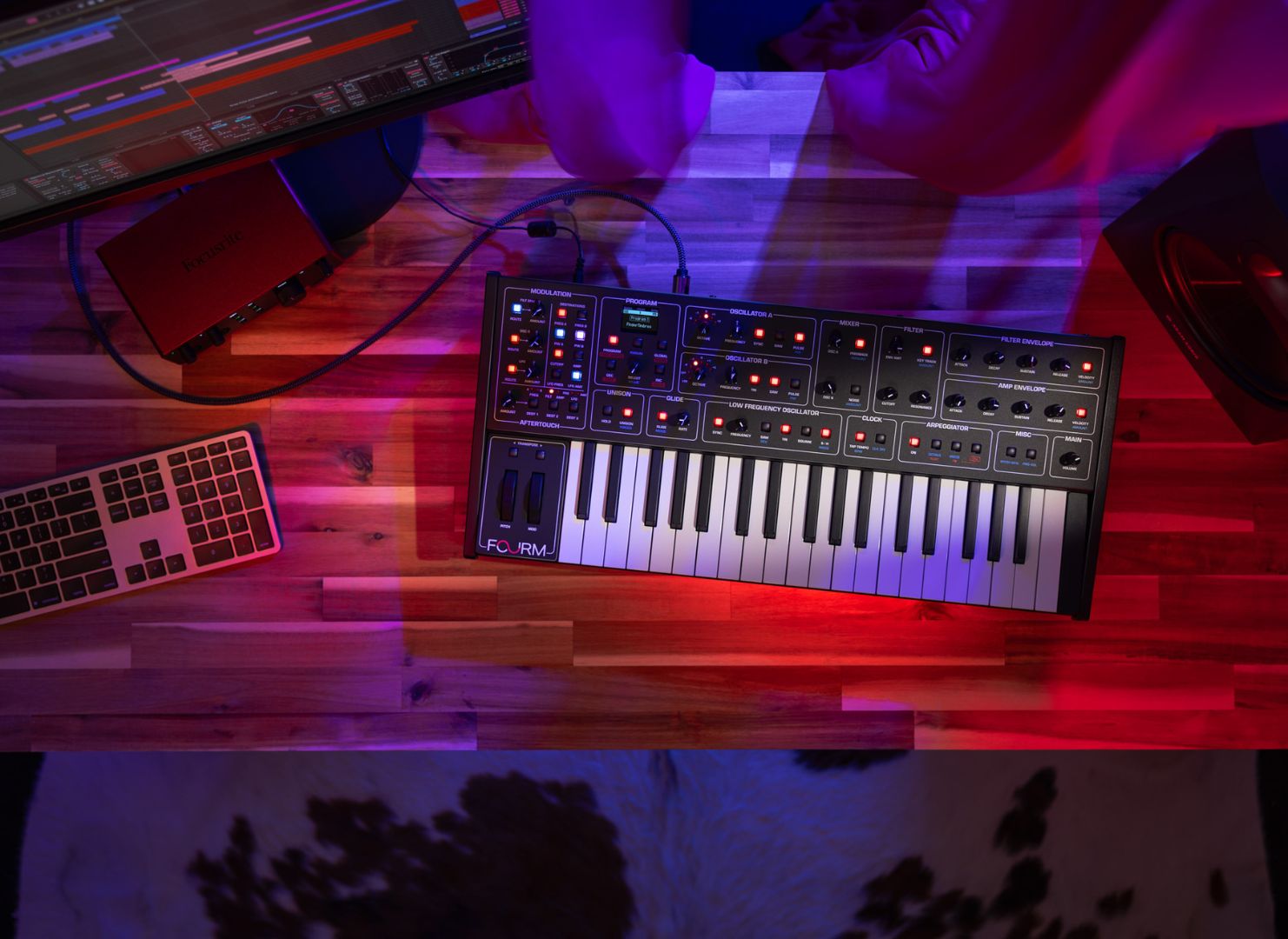 Sequential Fourm keyboard synthesizer, compact design with multiple knobs and keys, ideal for music production and performance.