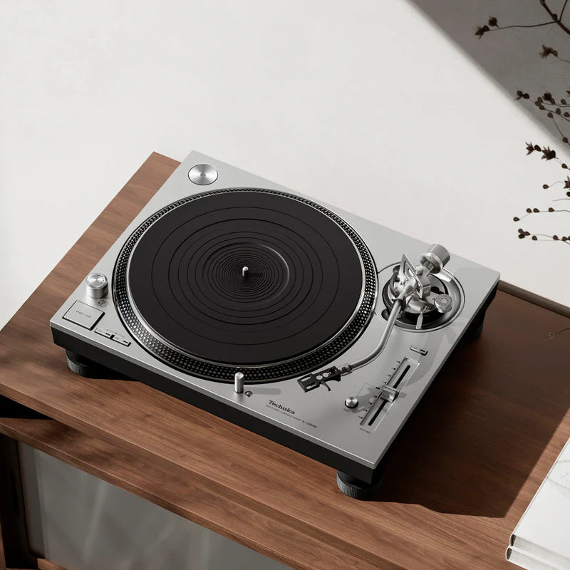 Technics SL-1200GR2 turntable with black finish, tonearm, and control knobs, showcasing its sleek design and sturdy build.