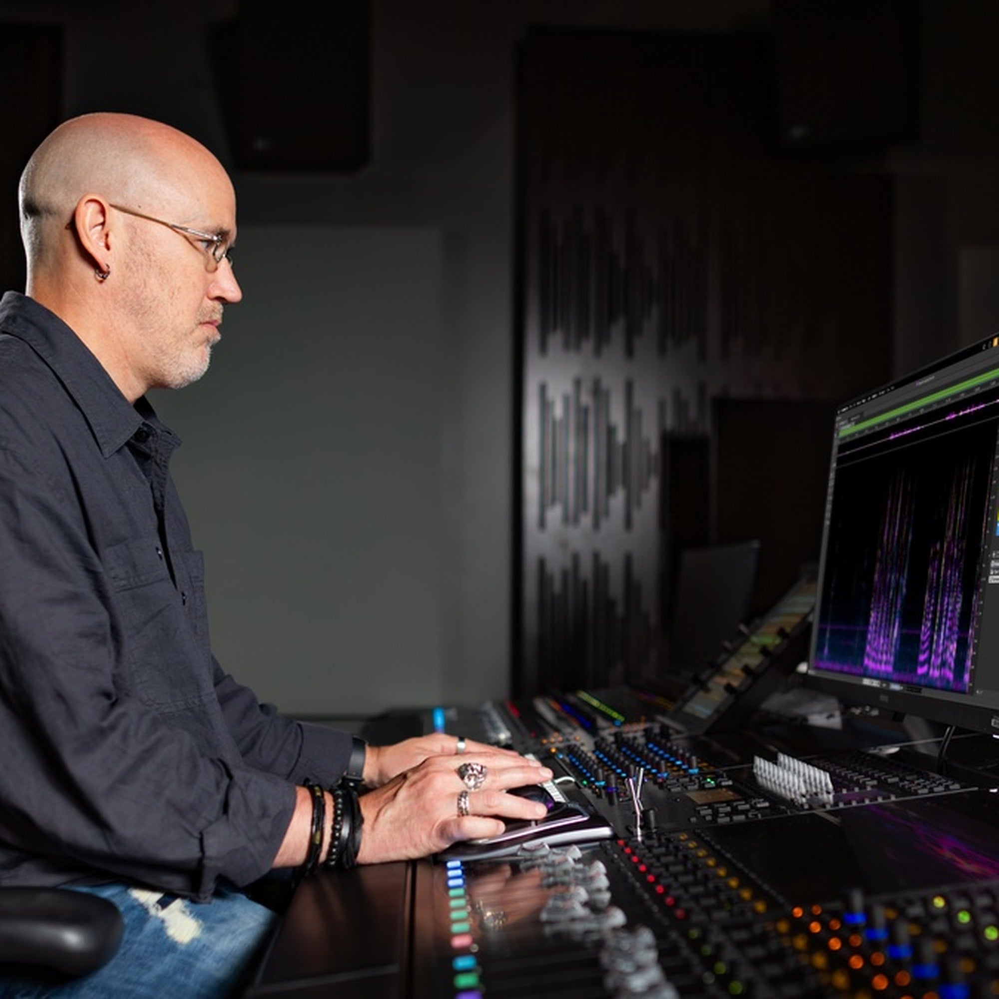 Audio engineer using Steinberg SpectraLayers Pro 13 spectral editing software in a professional studio.