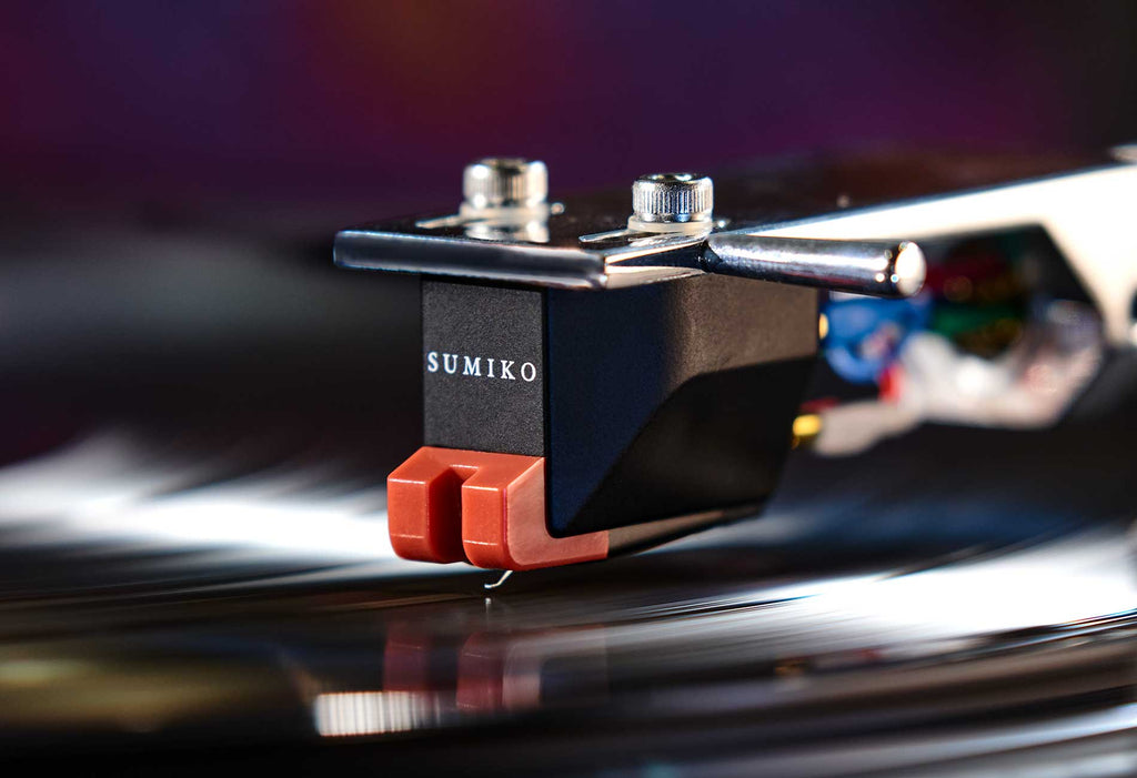 Sumiko Moonstone MM phono cartridge mounted on Technics 1200 turntable, showcasing the cartridge's design and stylus.