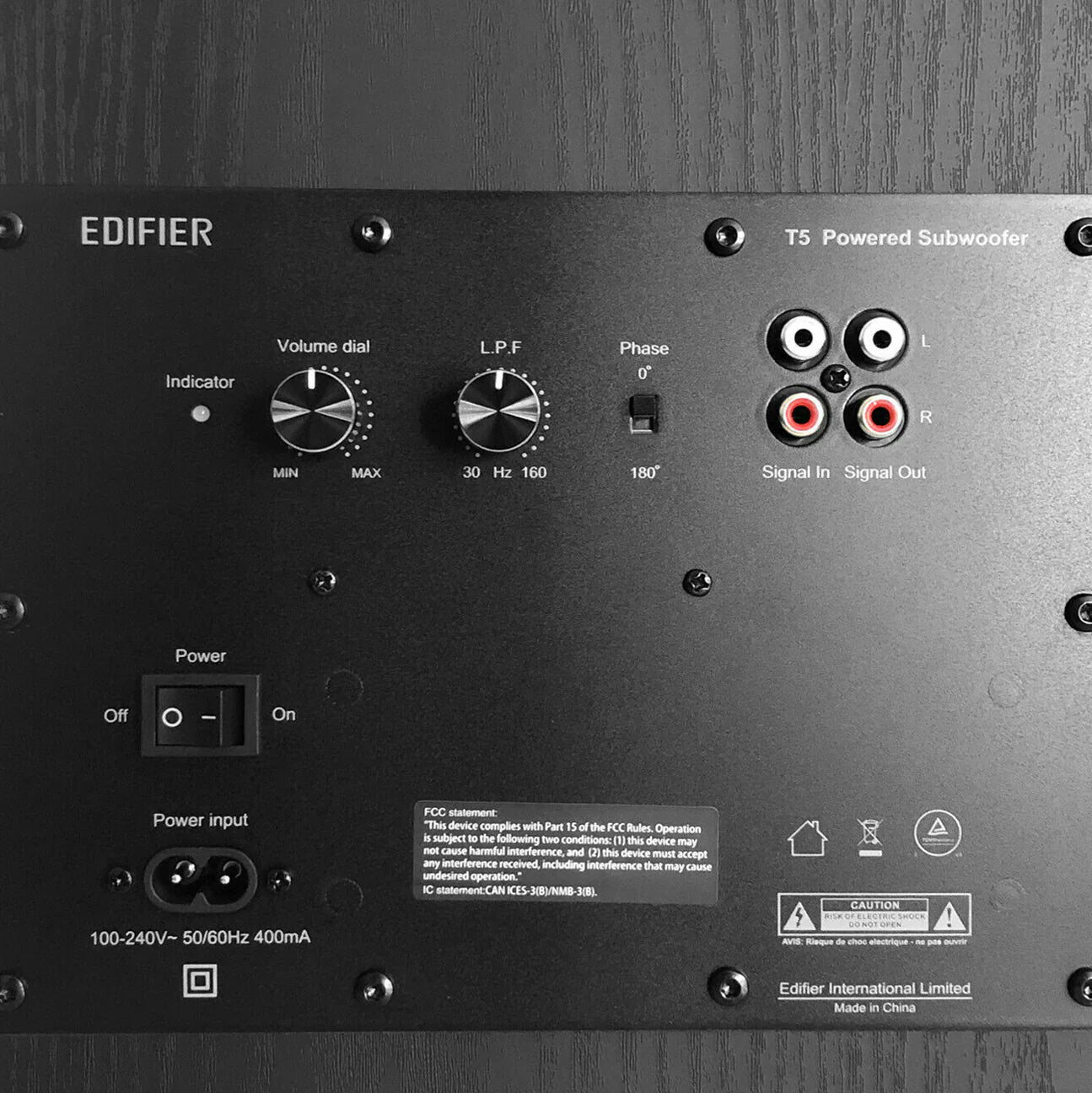 Edifier T5 powered subwoofer back view showing input ports, controls, and connection options for home audio setup.