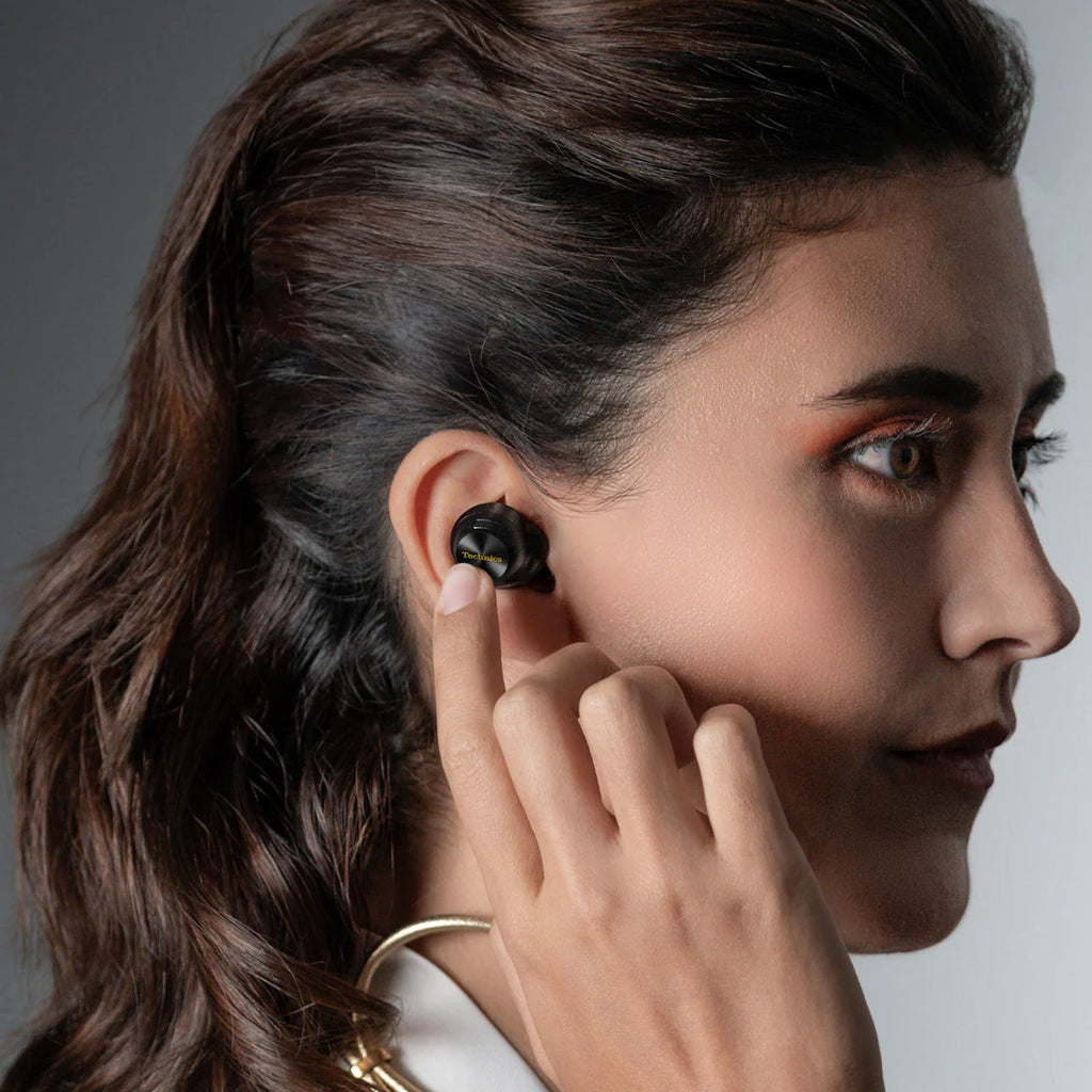 Technics EAH-AZ100 true wireless earbuds, in black, lifestyle setting