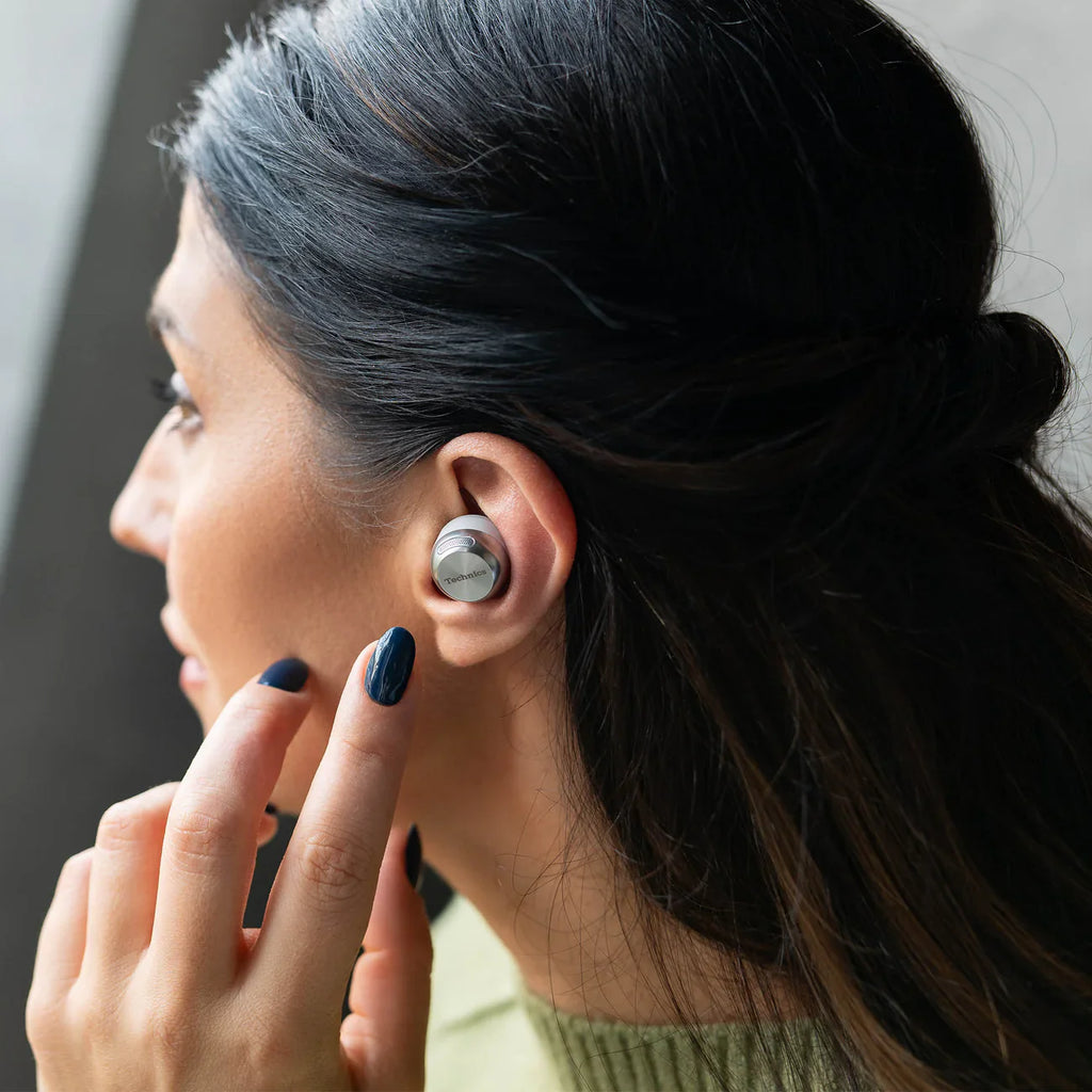 Technics EAH-AZ100 true wireless earbuds, in silver, lifestyle setting