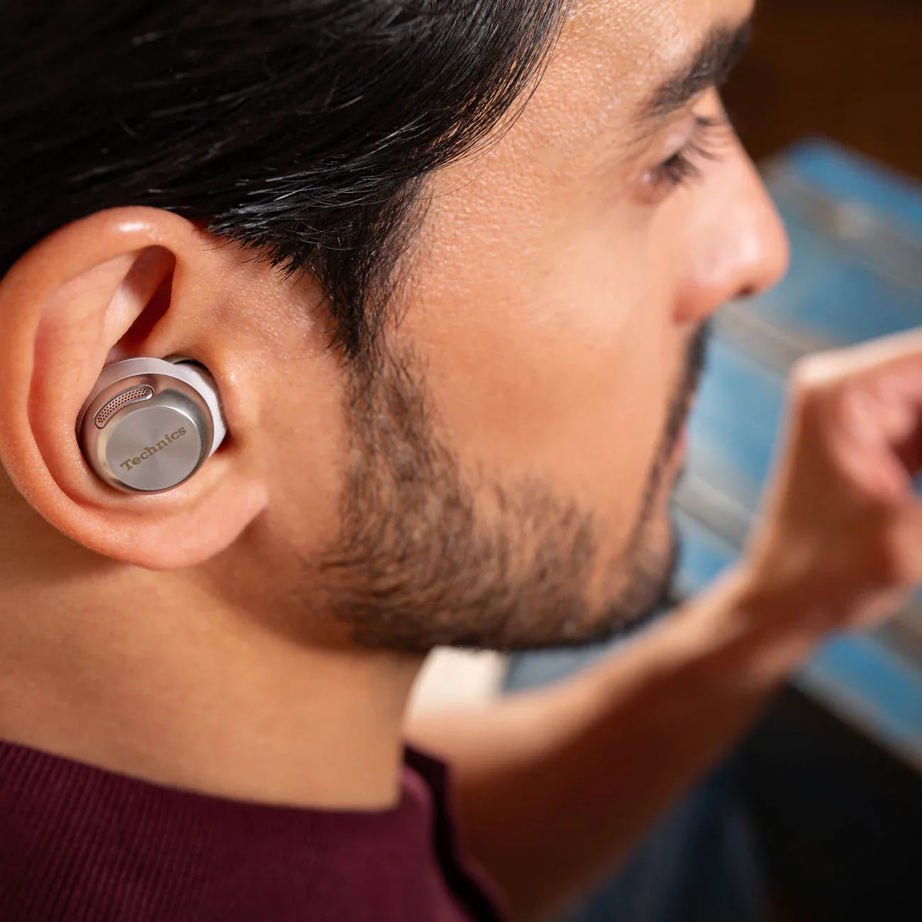 Technics EAH-AZ100 true wireless earbuds, in silver, lifestyle setting